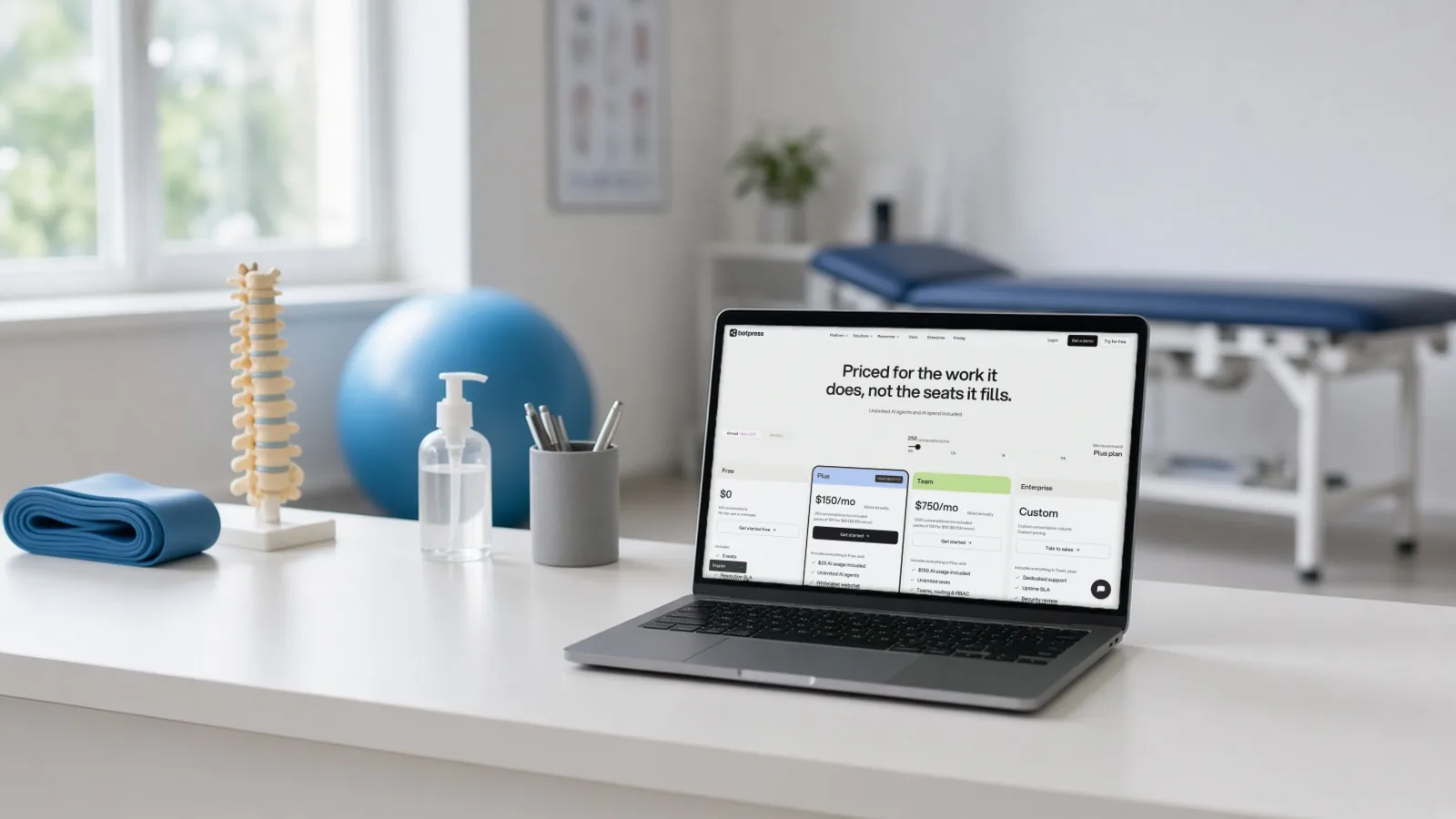 Laptop on a physiotherapy clinic counter showing Botpress chatbot plans, including a free tier